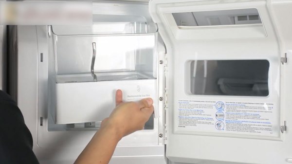 removing the ice bin assembly from the refrigerator
